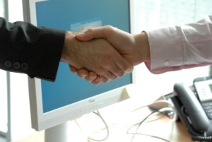 businessmen-shaking-hands-deal